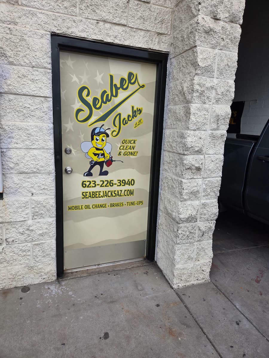 SeaBee Jack's branded shop door with phone number and website